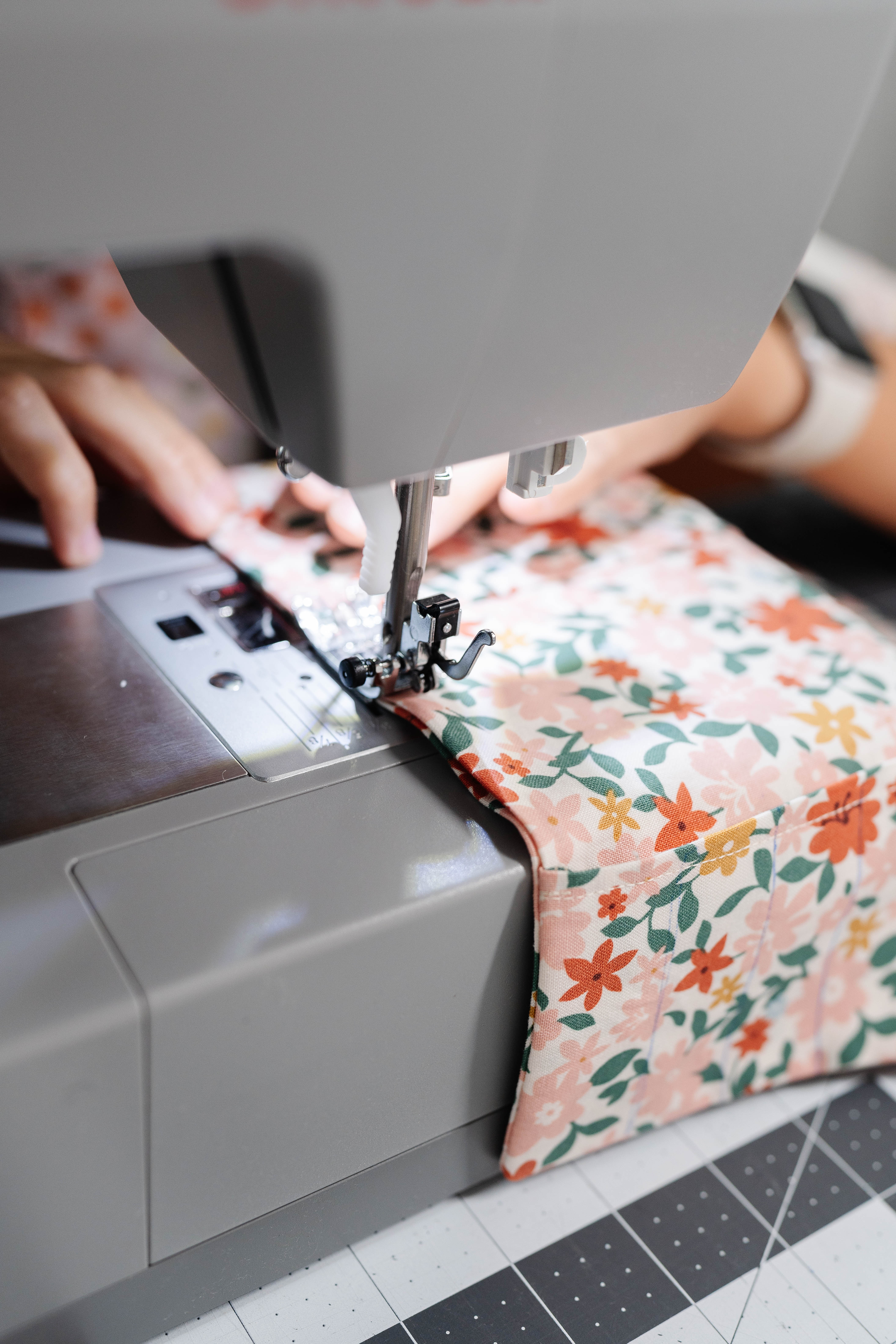 Happy Stitches sewing project supplies for a Crayon Wrap Roll, including fabric pieces, Clover Hot Ruler, Rotary Cutter, Heart-Shaped Pins, Wonder Clips, and Roll & Press